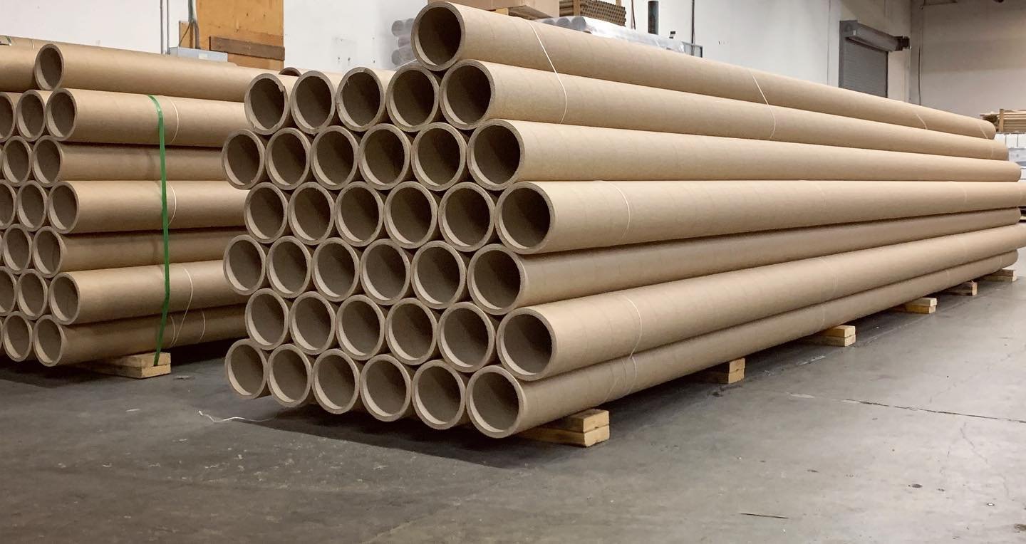 Long Hytech spiral paper tubes stacked horizontally on pallets